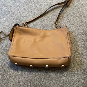 Tan Rebecca Minkoff woman’s purse Crossbody with gold studs